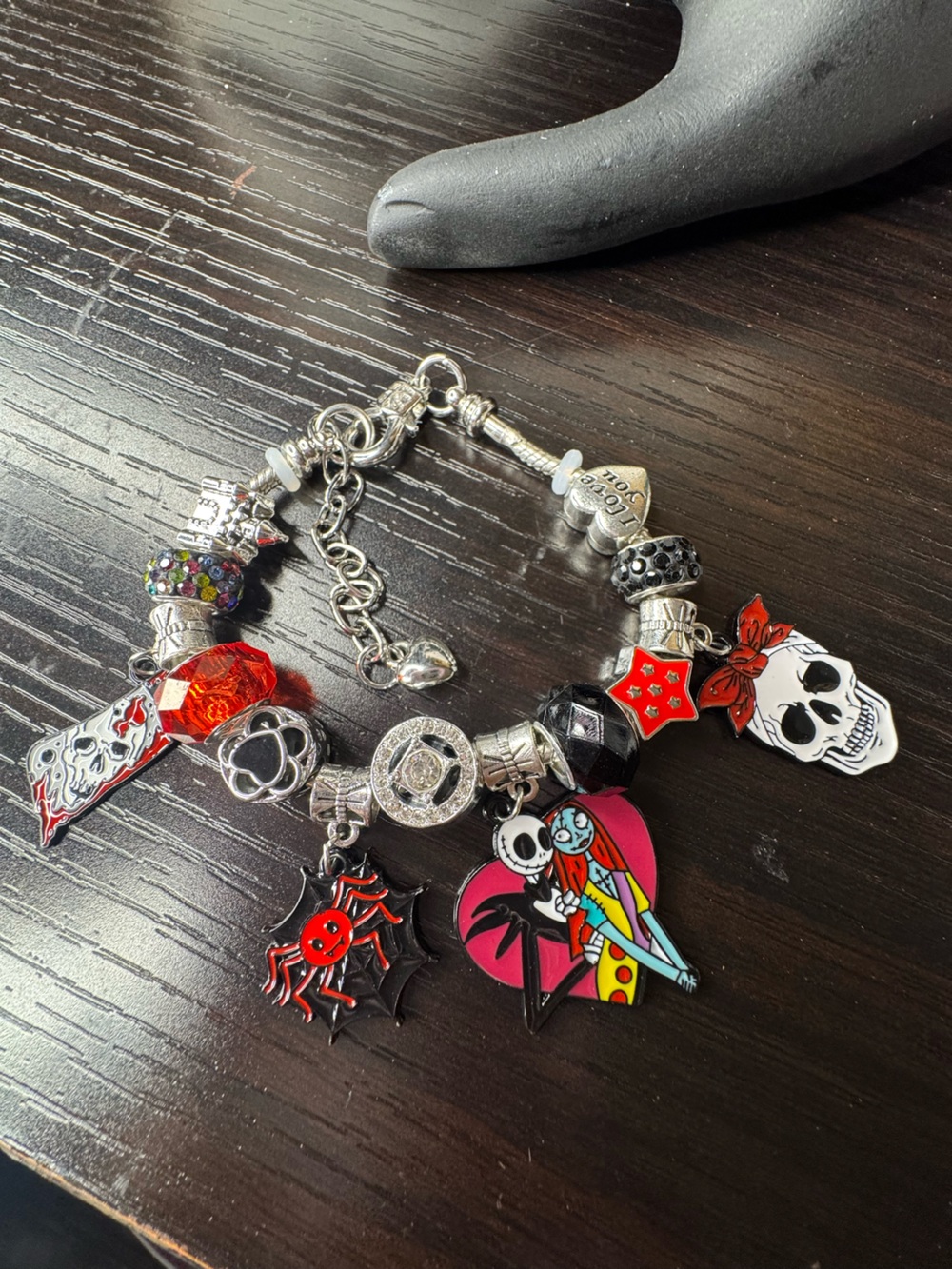Silver-Tone Charm Bracelet with Red and Black Skull & Heart Accents